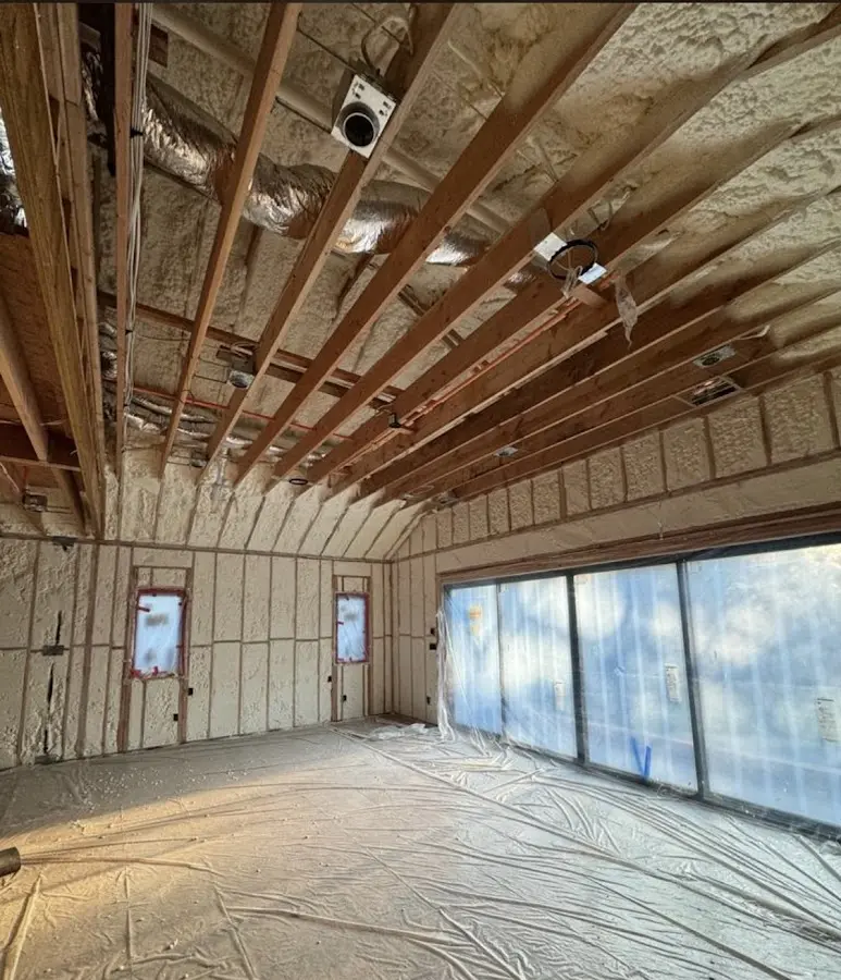 Interior walls and ceiling insulated with spray foam during new construction in Brookside